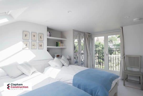 twin bedroom loft conversion blue blankets