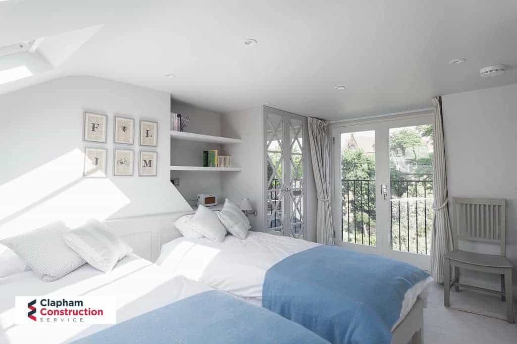 twin bedroom loft conversion blue blankets