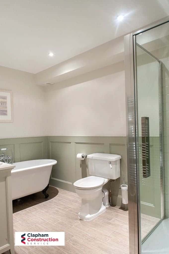 completed loft conversion bathroom with green paint