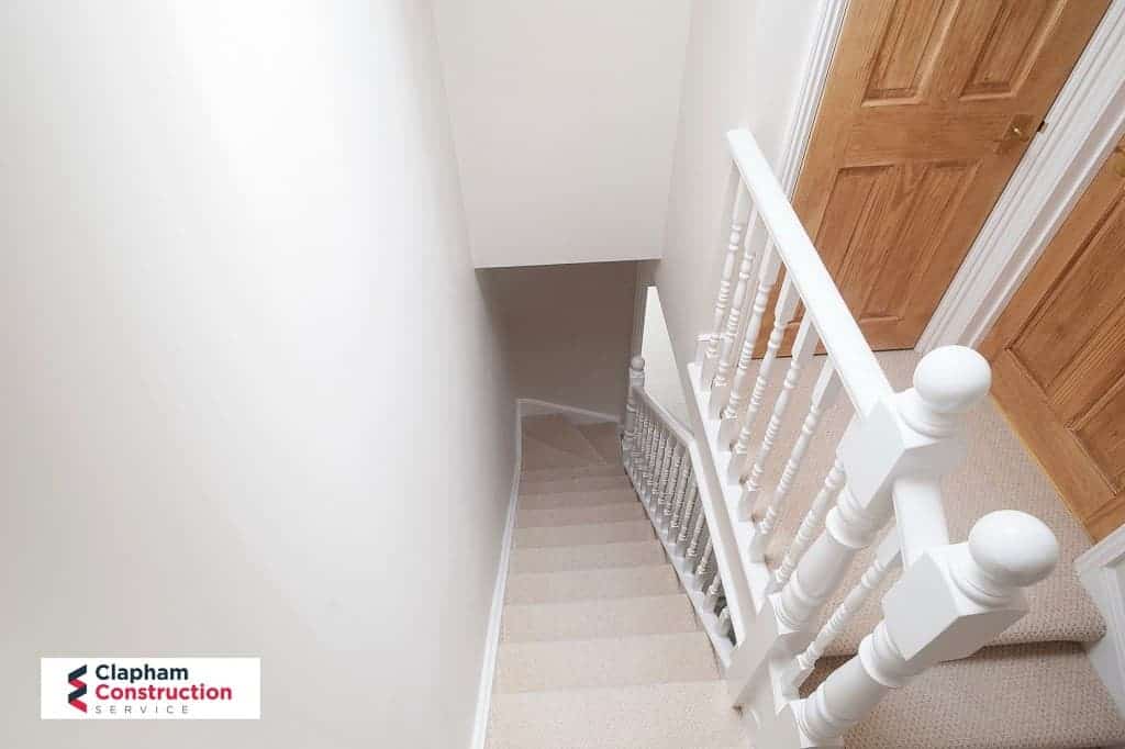 finished loft extension landing showing down stairs