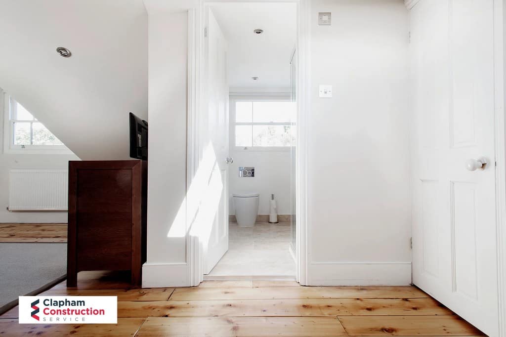 ferry-road-loft-conversion-bathroom- completed loft conversion bathroom with tiled floor