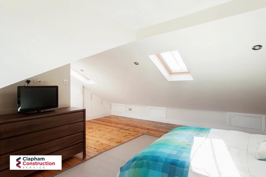 ferry-road-loft-conversion-bedroom finished loft extension with oak floor and skylight