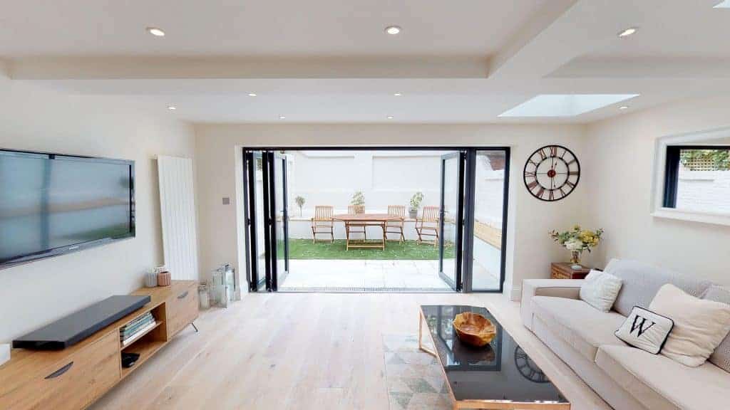 completed home extension and garden white brick wall
