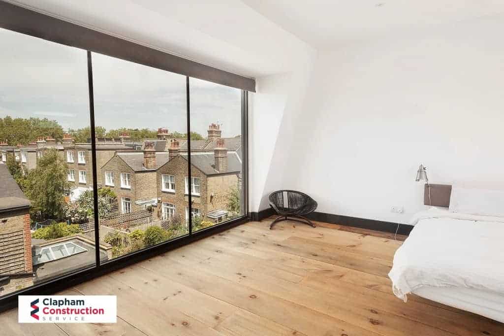 finished loft conversion with floor to ceiling windows