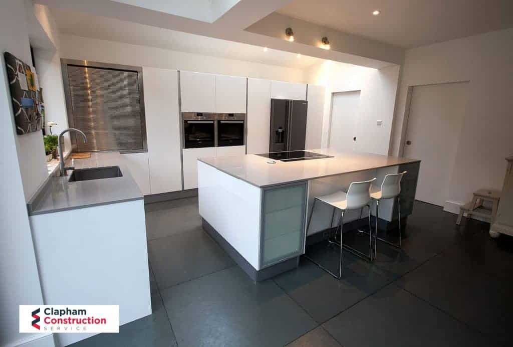 completed home extension black floor kitchen